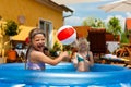 Children playing with ball in water pool Royalty Free Stock Photo