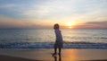 Children playing on the beach at sunset. sea, Travel and vacation concept, Summer time concept