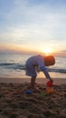 Children playing on the beach at sunset. sea, Travel and vacation concept, Summer time concept Royalty Free Stock Photo