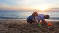 Children playing on the beach at sunset. sea, Travel and vacation concept, Summer time concept