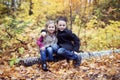 Children playing in beautiful autumn park on cold sunny fall day. Royalty Free Stock Photo