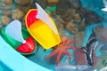 Children Playing with Boats and Sea Creature/Ocean Life Toys in a Water Table Royalty Free Stock Photo