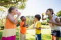 Children playing with bubble wand Royalty Free Stock Photo