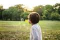 Children is playing bubbles in a park Royalty Free Stock Photo