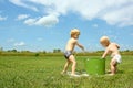 Children Playing with Bucket of Bubbles