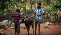 Children playing with calf in village