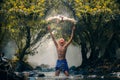 Children playing catch duck in river