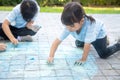 Children playing with colored chalks Royalty Free Stock Photo