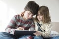 Children playing with a digital tablet