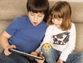 Children playing with a digital tablet Royalty Free Stock Photo