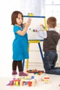 Children playing with drawing board