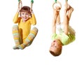 Children playing and exercising on gymnastic rings Royalty Free Stock Photo