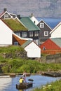 Children playing in Faroe traditional picturesque colorful village