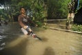 CHILDREN PLAYING AT FLOOD