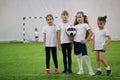 Children playing football indoors. Girls football team