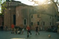 children playing football next to Chiesa Parrocchiale di San Giacomo dall Orio, venice, italy - nov, 2021 Royalty Free Stock Photo
