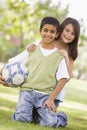 Children playing football in park Royalty Free Stock Photo