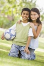 Children playing football in park Royalty Free Stock Photo