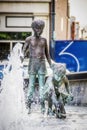 Children playing in fountains statues in Charlotte North Carolina Wells Fargo Plaza