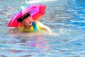 A child is playing happily in the water