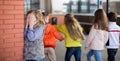 Children playing hide and seek in the schoolyard