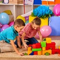 Children playing in kids club indoor. Lesson in primary school.