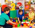 Children playing in kids cubes indoor. Lesson in primary school. Royalty Free Stock Photo