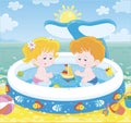 Children playing in a kids pool on a beach Royalty Free Stock Photo