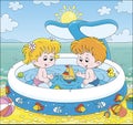 Children playing in a kids pool on a beach Royalty Free Stock Photo