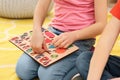 Children playing with math game kit on floor, closeup. Learning mathematics with fun Royalty Free Stock Photo