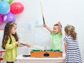 Children playing mini billiard Royalty Free Stock Photo