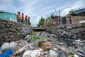 Children Playing Near The Aqueduct Full Of Garbage And Waste By The Ozama River Royalty Free Stock Photo