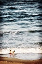 Children Playing in the Ocean Royalty Free Stock Photo