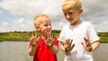 Children playing outdoor showing dirty muddy hands. Royalty Free Stock Photo