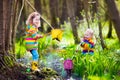 Children playing outdoors catching frog Royalty Free Stock Photo