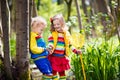 Children playing outdoors catching frog Royalty Free Stock Photo