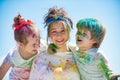 Children playing with paints outdoor. Close up portrait of an excited little kids. Beautiful young people with painted Royalty Free Stock Photo