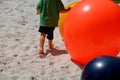 Children playing on a plastic inflatable tarpaulin. it`s a bubble that jumps on. the compressor inflates it and there is silica sa