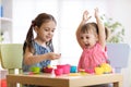 Children playing with plastic tableware