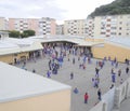 Children playing in school playground Royalty Free Stock Photo