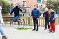 Children playing rubber band jumping game and laughing