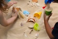 Children Playing In The Sand