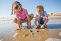 Children playing with sand on the shore Royalty Free Stock Photo