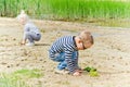 Children playing in the sand on the shore of Lake Royalty Free Stock Photo