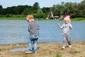 Children playing in the sand on the shore of Lake Royalty Free Stock Photo