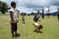 Children playing on the school field working on the headstands Royalty Free Stock Photo