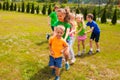 Children playing snake game outdoor, funny time