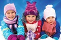 children playing on snow in winter time Royalty Free Stock Photo