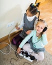 Children playing with sockets and electricity indoors Royalty Free Stock Photo