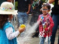 Children playing with spray foam on carnival, Cuenca